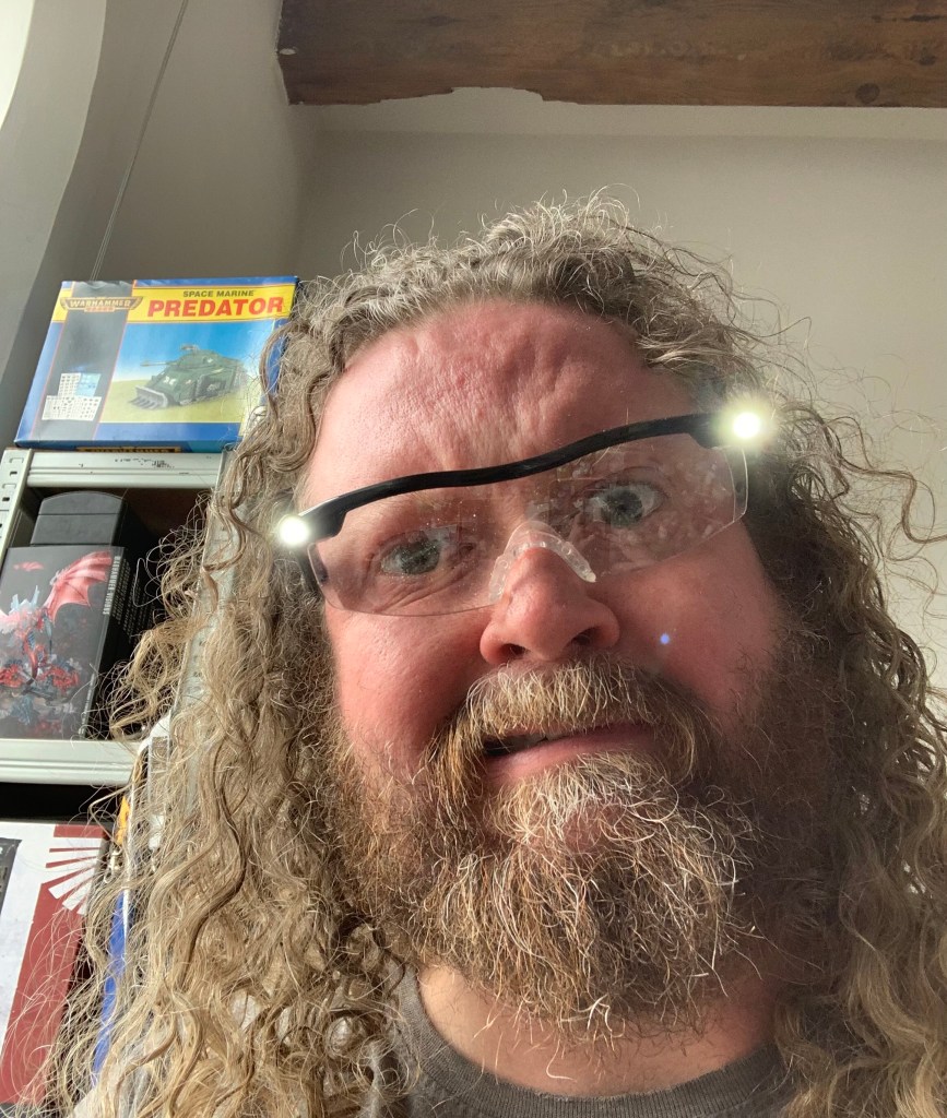 me wearing magnifying glasses