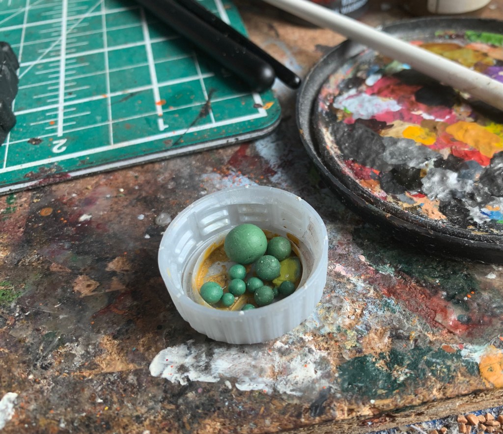 little green balls in a pot